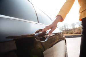 woman opening car door | Sioux Falls body shop repair