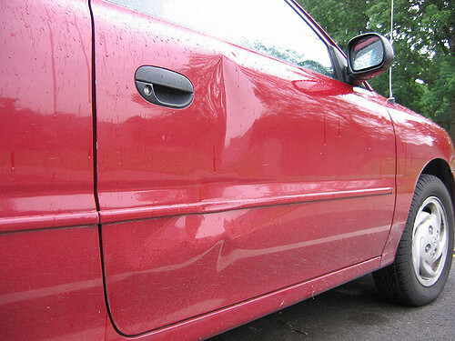 Red dented car | Brandon ding repair