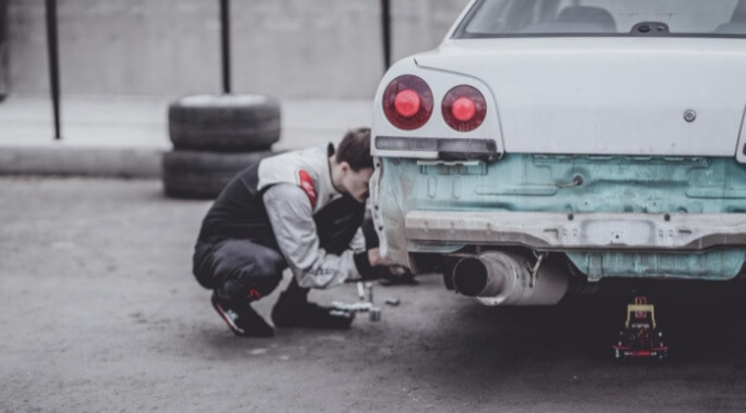 Man fixing car